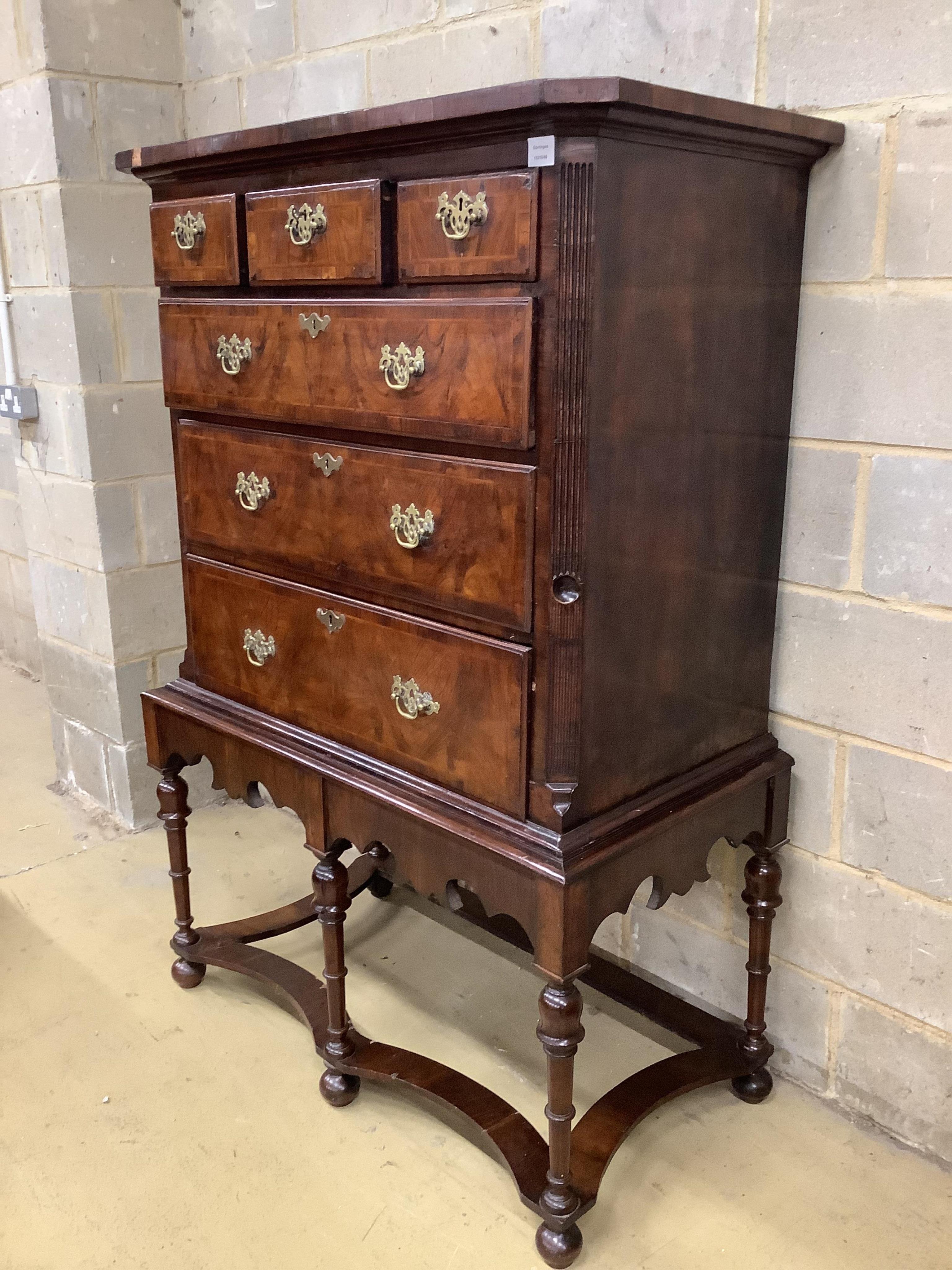 An 18th century walnut chest on later stand, width 106cm, depth 56cm, height 159cm. Condition - fair to good